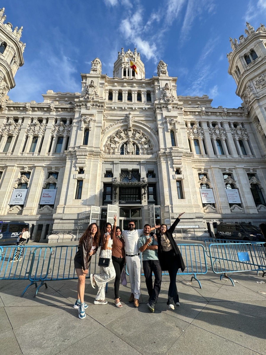 A Party Passport group posing in front of the Palacio de Cibeles in Madrid